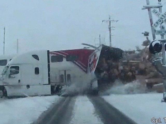 Video shows commuter train crash into semi truck, cutting it in half