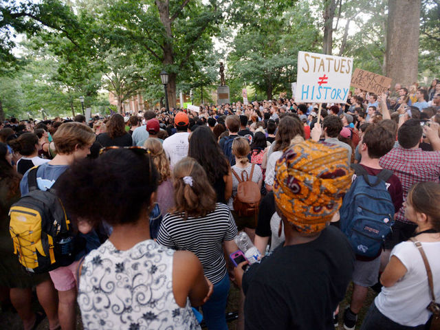Crowd of 250 protesters knocks over controversial Silent Sam Confederate statue